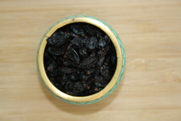 Barberry berries in a ceramic plate.