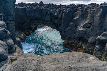 Azores, on Sao Miguel Island at the Ponta da ferraria. Beautiful scenery when lava rocks meet the blue sea