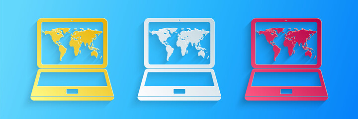 Paper cut Laptop with world map on screen icon isolated on blue background. World map geography symbol. Paper art style. Vector.