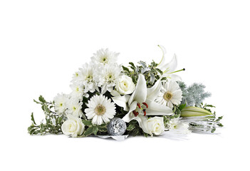 Christmas bouquet of white flowers with silver decorations, placed on a white surface