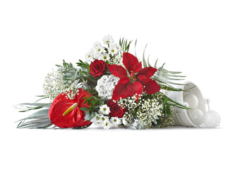 Christmas bouquet of white and red flowers resting on a white surface
