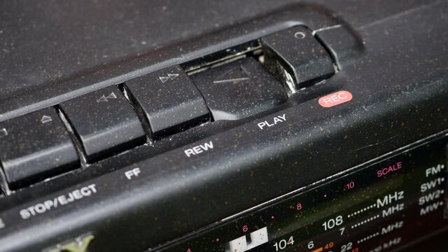 Pressing Play Button On An Retro Cassette Tape Recorder.