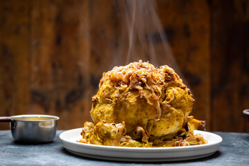 Whole roated cauliflower in curry sauce