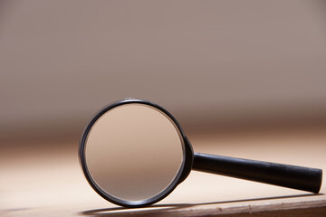 magnifying glass on the wooden table