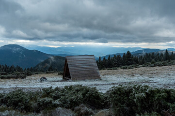 Wooden comfort in the snowy mountains. A place to relax in the mountains.