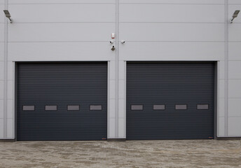 Close-up of automatic metal roller doors used in factory, warehouse, garage and industrial...