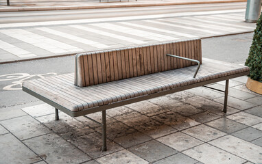 Modern wooden bench. City improvement, urban planning, public spaces