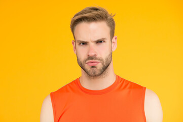 seriousness itself. unshaven guy with bristle. male sporty fashion. confident man in fitness vest....