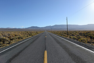 Road across a desert valley 