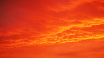 red sunset with clouds in the evening . sky background in bright colors