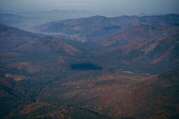 A view of a canyon with a mountain in the background