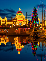 Fototapeta premium Inner Harbor in Victoria BC, Vancouver Island, Canada, decorated with festive lights during Christmas time