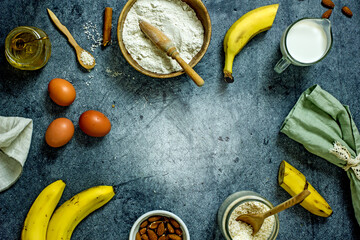 Ingredients for baking sugar-free pumpkin baked goods with honey. Flour, pumpkin, eggs, honey, nuts, spices on a gray background, top view, flat lay, copy space