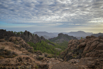 Valley full of mountains and volcanic rocks in Gran Canaria during sunset.