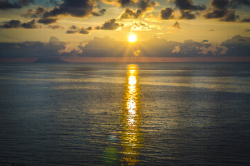 Watercolor drawing of Aerial view of beautiful amazing sea sunset, seascape and endless horizon with color dramatic sky with clouds and volcano hill mountain island Stromboli, Tropea, Calabria, Italy