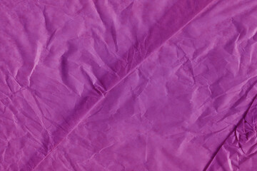 Fototapeta premium Violet vintage and old looking crumpled paper background. Retro cardboard texture. Grunge paper for drawing. Ancient book page. Present wrapping.