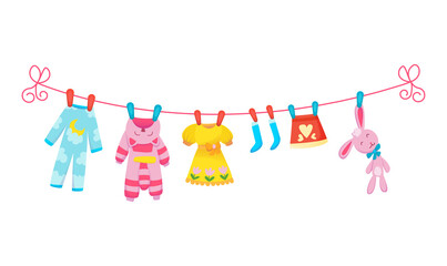 Various items of baby clothes on rope isolated illustration on white background. Laundry held by plastic pegs drying.