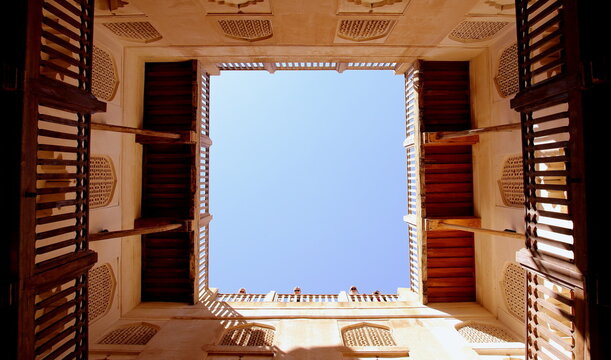 Blue sky framed by the walls and decorations of Jibreen Castle, Bahla, Nizwa, Oman