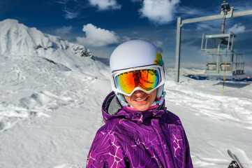 Young woman in ski goggles outdoors