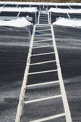 pedestrian walk steps in snow removed parking lot