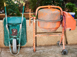Wheelbarrow and concrete mixer for mixing and making cement and concrete on a construction site