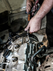 Repair the engine. Tools, oil, nozzles, cylinder block, painting, cleaning, diesel internal combustion engine for a car.