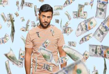 Handsome hispanic man wearing casual clothes skeptic and nervous, frowning upset because of...