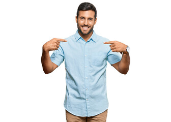 Handsome hispanic man wearing casual clothes looking confident with smile on face, pointing oneself with fingers proud and happy.