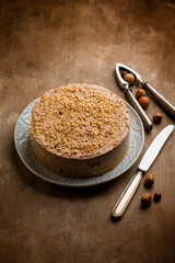 hazelnut cheese cake over wooden background