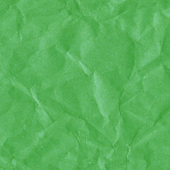 Green vintage and old looking crumpled paper background. Retro cardboard texture. Grunge paper for drawing. Ancient book page. Present wrapping.