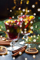 Christmas hot drink in glass and  fir tree branches