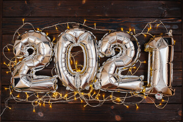 Happy new year 2021. Large inflatable figures 2021 decorated with a garland