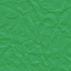 Green vintage and old looking crumpled paper background. Retro cardboard texture. Grunge paper for drawing. Ancient book page. Present wrapping.