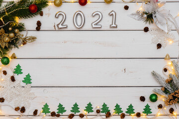 White Christmas background decorated with festive decor, lanterns, snowflakes and Christmas tree branches. Christmas greeting card. Winter holiday season. Happy New Year