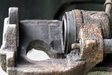 The caliper, the disc brake component of a car.