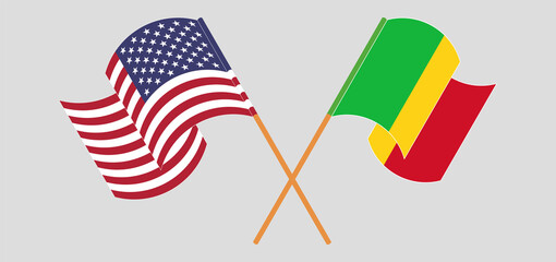 Crossed and waving flags of Mali and the USA