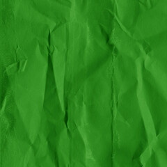 Green vintage and old looking crumpled paper background. Retro cardboard texture. Grunge paper for drawing. Ancient book page. Present wrapping.