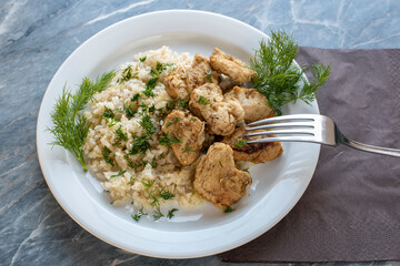 cooked dish boiled rice with fried turkey pieces