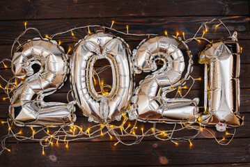 Happy new year 2021. Large inflatable figures 2021 decorated with a garland