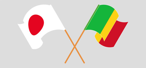 Crossed and waving flags of Mali and Japan