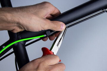 Adjustment and repair of bicycle mechanisms. DIY car repair concept