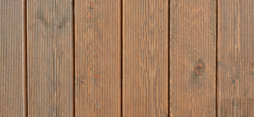 Background from vertical brown wooden planks decking. H