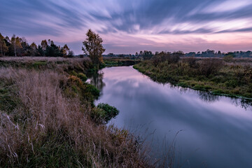 Fototapeta na wymiar Evening sunset near the river