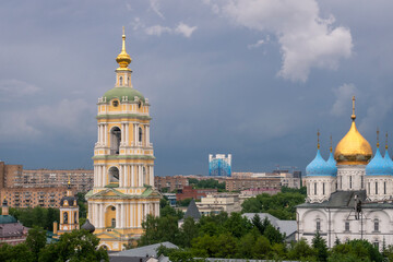 Fototapeta na wymiar Moscow cityspace with Church and bell tower at Novospassky convent on cloudy day.