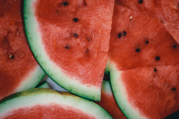 Bright red fresh watermelon slices top view.