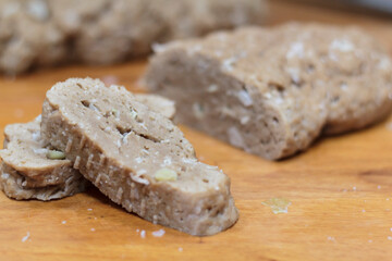 Homemade sliced seitan on wooden board