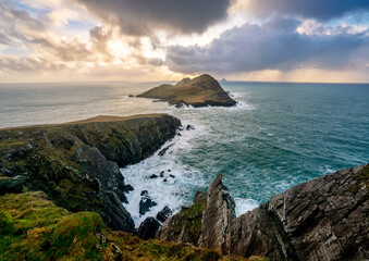 Puffin Island, Ireland, Storm Eleanor with sunrays and crashing atlantic waves panorama with skellig in distance