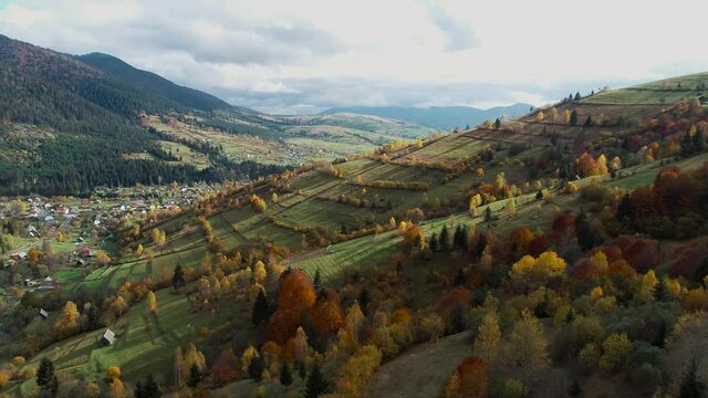 Mountain hill landscape autumn season. Aerial view of the village Synevyr. Carpathian Mountains, Ukraine, Europe. Majestic landscape. Beauty world. 4K