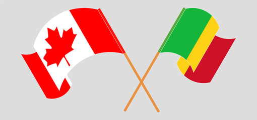 Crossed and waving flags of Mali and Canada