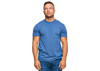 Fototapeta premium Handsome muscle man wearing casual clothes relaxed with serious expression on face. simple and natural looking at the camera.